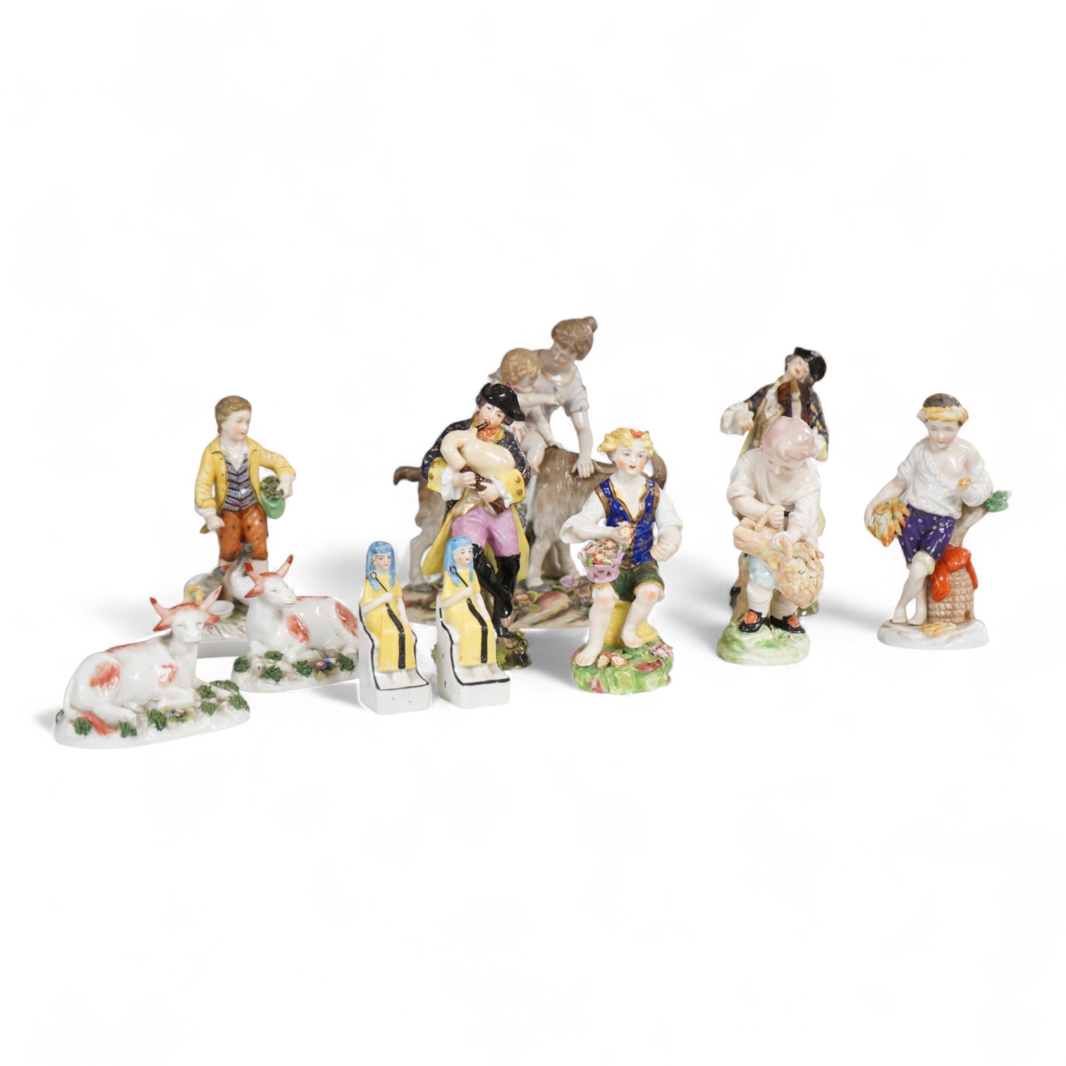 Two Derby porcelain seated figures emblematic of summer and autumn and a collection of Continental porcelain figures to include a pair of recumbent cows, largest 18cm high